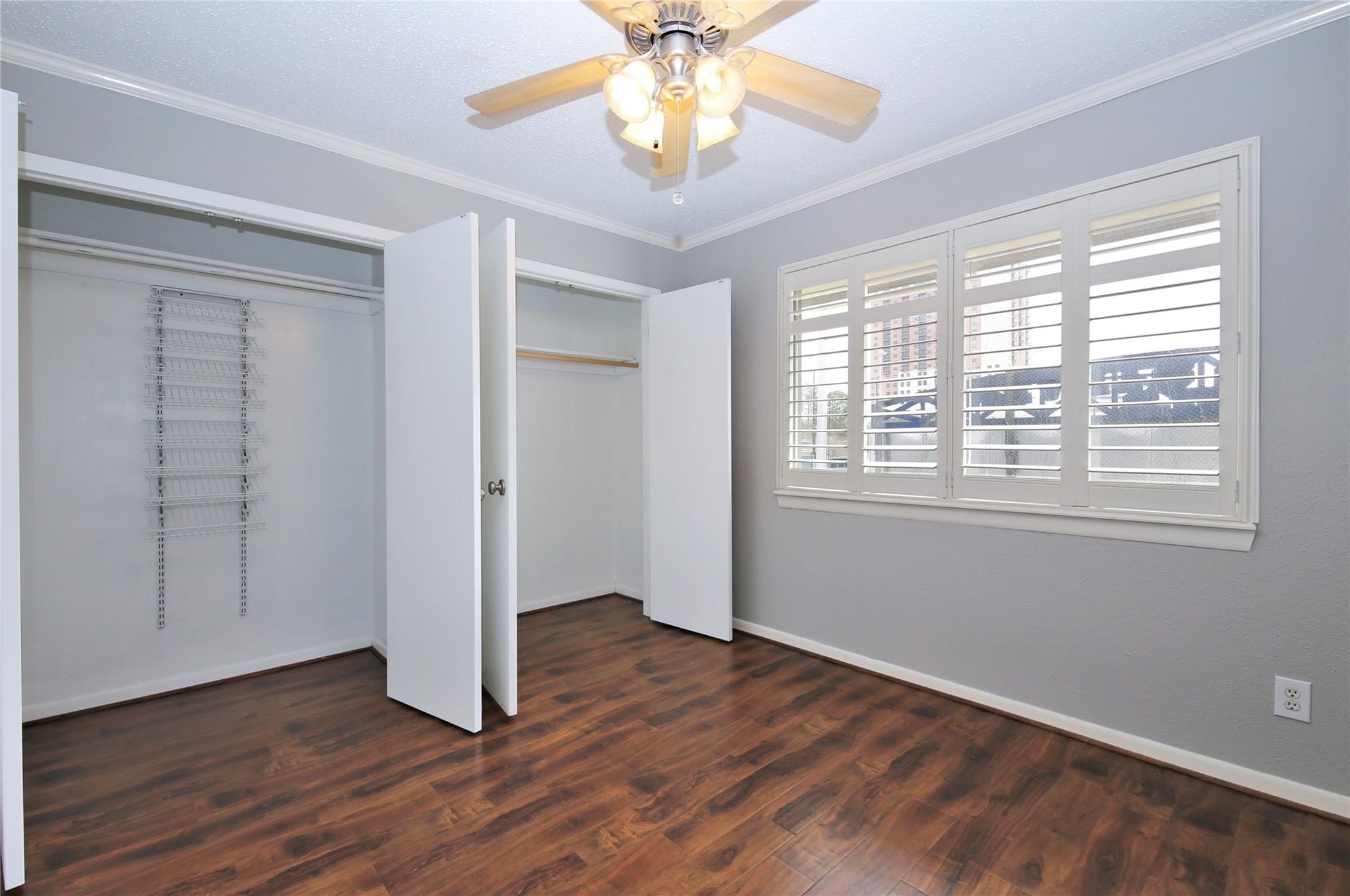 6433 Bayou Glen Road, Unit 6433 Houston, TX 77057 - Photo 10 of 19 a view of an empty room with wooden floor and a window
