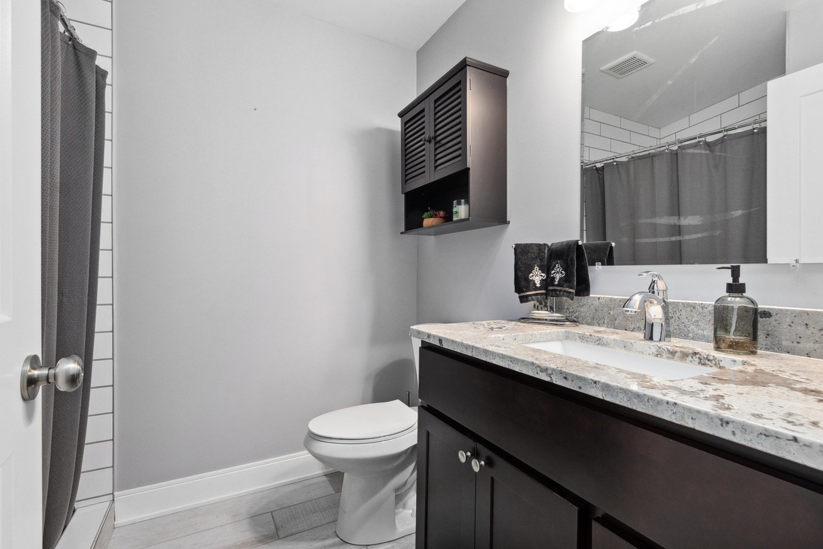 11426 South Brightway Road Mokena, IL 60448 - Photo 22 of 39 a bathroom with a granite countertop toilet sink and mirror