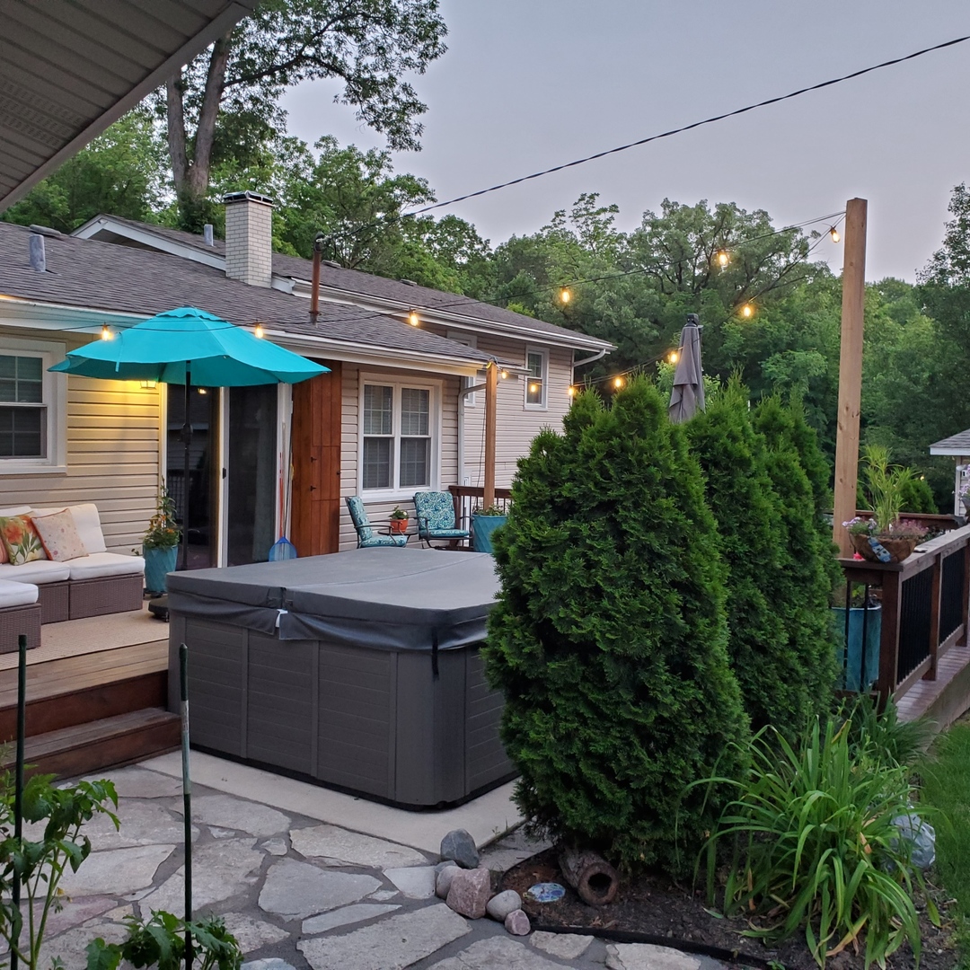 11426 South Brightway Road Mokena, IL 60448 - Photo 28 of 39 a view of a house with backyard sitting area and tub