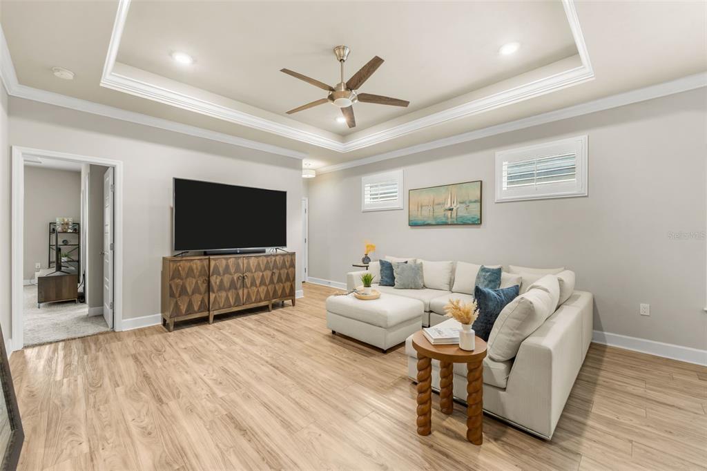 9437 Southwest 67th Lane Gainesville, FL 32608 - Photo 11 of 41 a living room with furniture and a flat screen tv