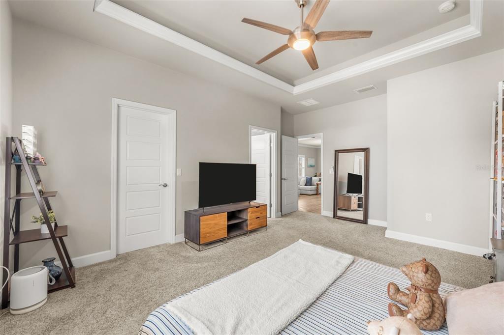 9437 Southwest 67th Lane Gainesville, FL 32608 - Photo 13 of 41 a view of a livingroom with furniture and a flat screen tv