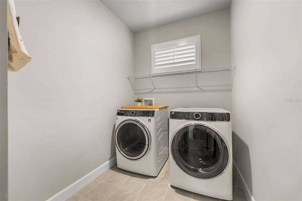 9437 Southwest 67th Lane Gainesville, FL 32608 - Photo 21 of 41 a utility room with dryer and washer