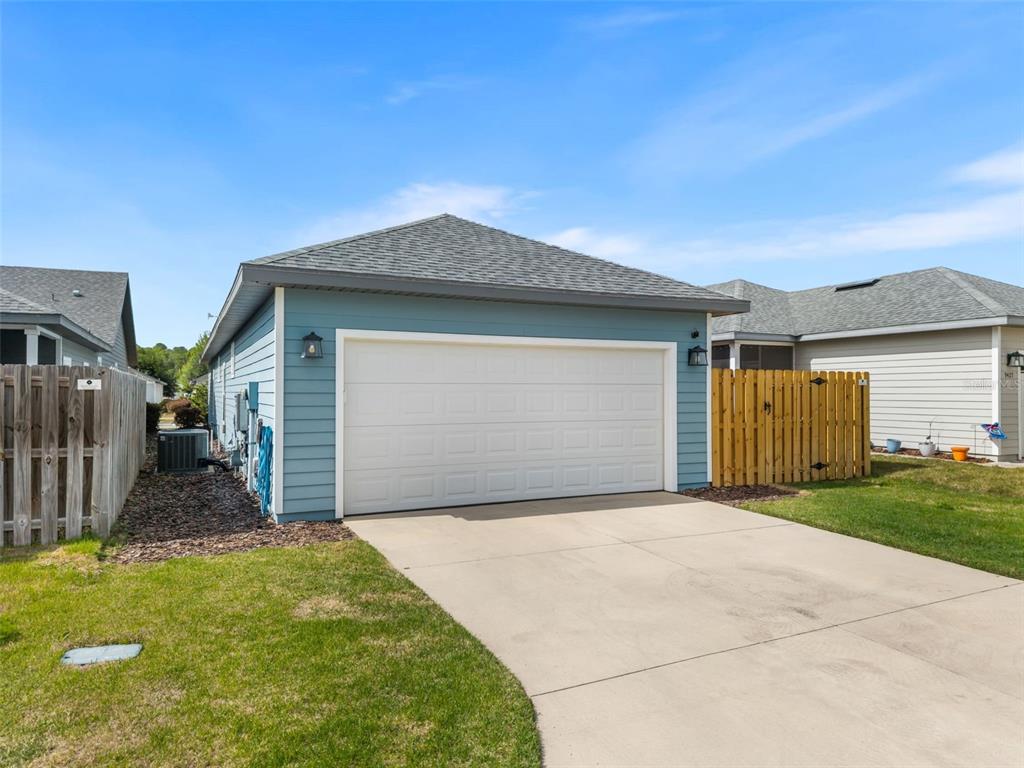 9437 Southwest 67th Lane Gainesville, FL 32608 - Photo 25 of 41 a front view of house with yard and garage