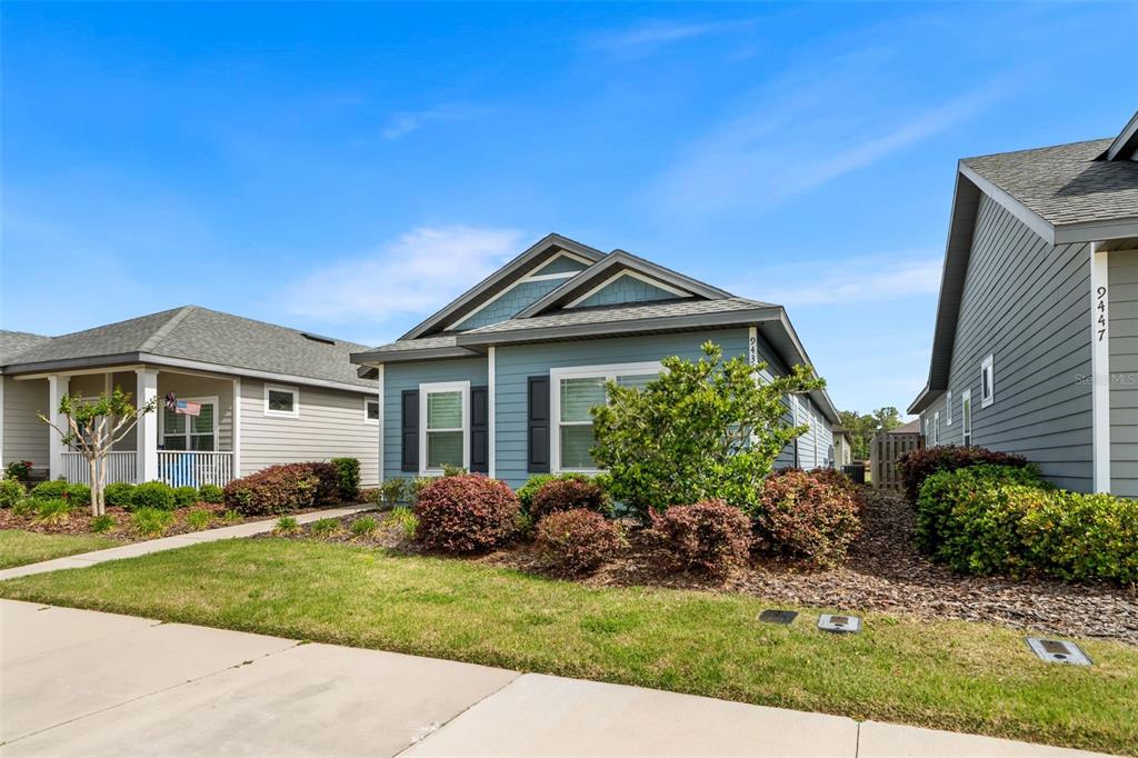 9437 Southwest 67th Lane Gainesville, FL 32608 - Photo 27 of 41 a front view of a house with a yard