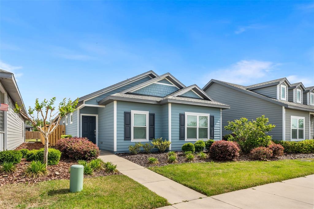 9437 Southwest 67th Lane Gainesville, FL 32608 - Photo 28 of 41 a front view of a house with garden