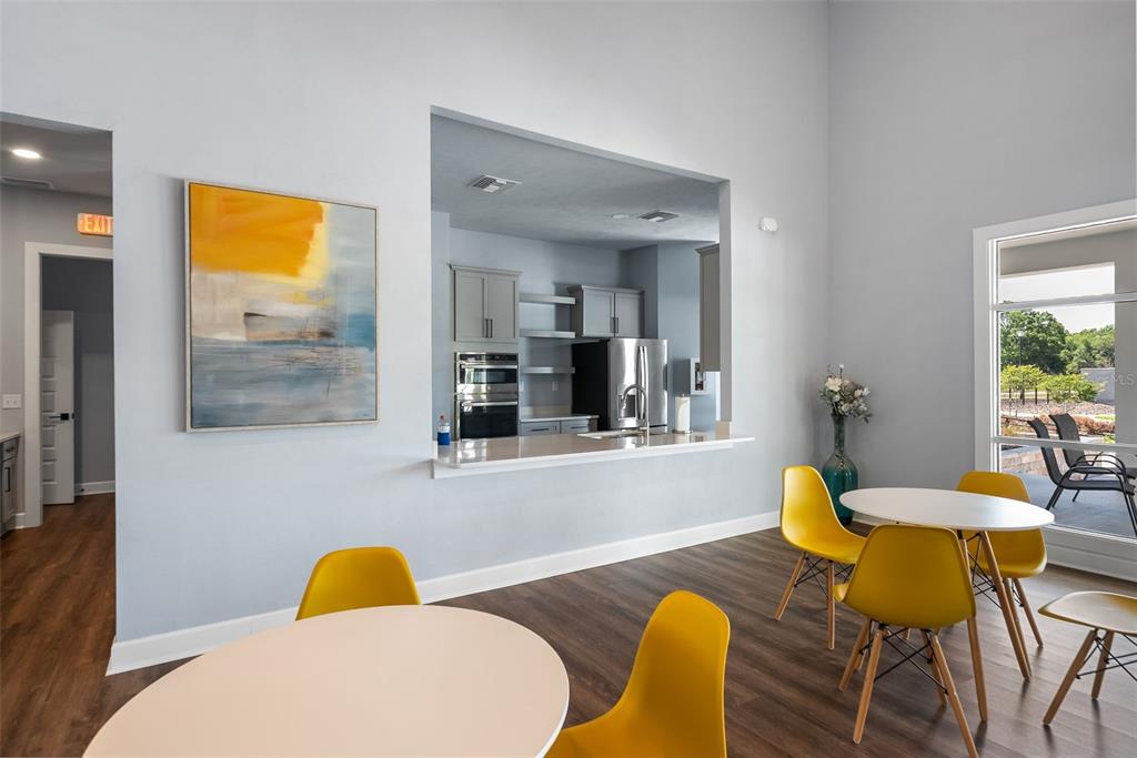 9437 Southwest 67th Lane Gainesville, FL 32608 - Photo 36 of 41 a view of a dining room with furniture and wooden floor