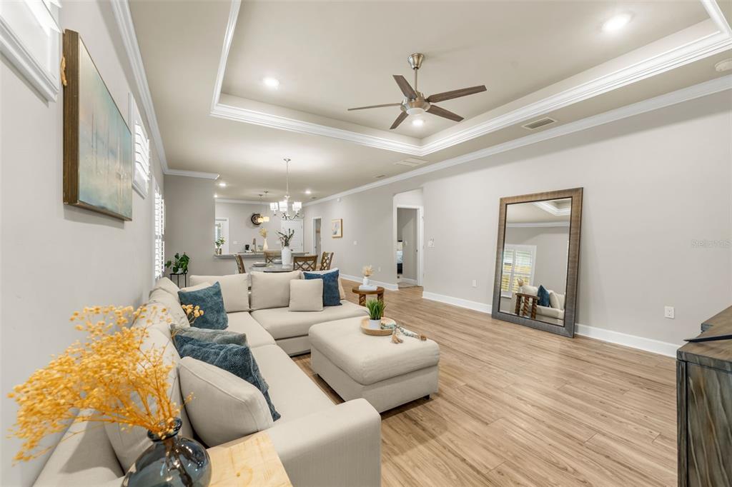 9437 Southwest 67th Lane Gainesville, FL 32608 - Photo 4 of 41 a living room with furniture and a wooden floor
