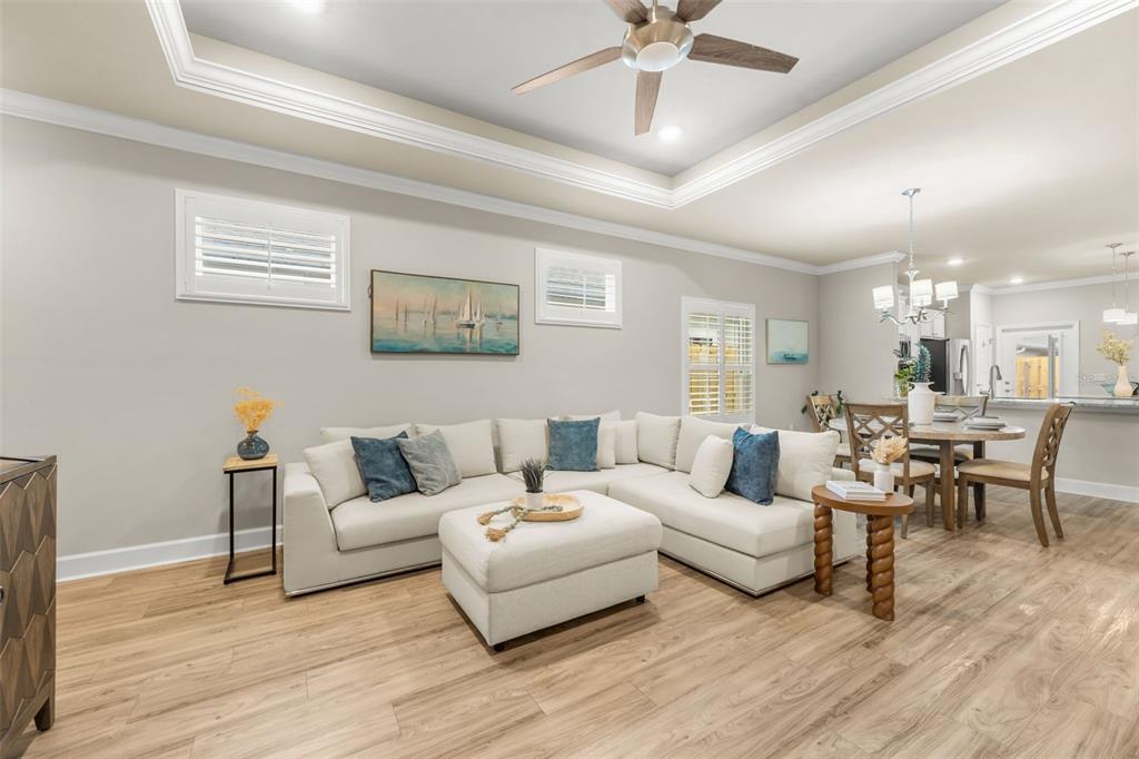 9437 Southwest 67th Lane Gainesville, FL 32608 - Photo 5 of 41 a living room with furniture and a large mirror