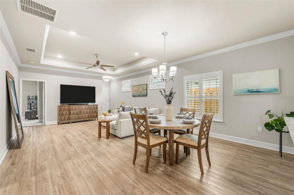 9437 Southwest 67th Lane Gainesville, FL 32608 - Photo 7 of 41 a view of a dining room with furniture and wooden floor