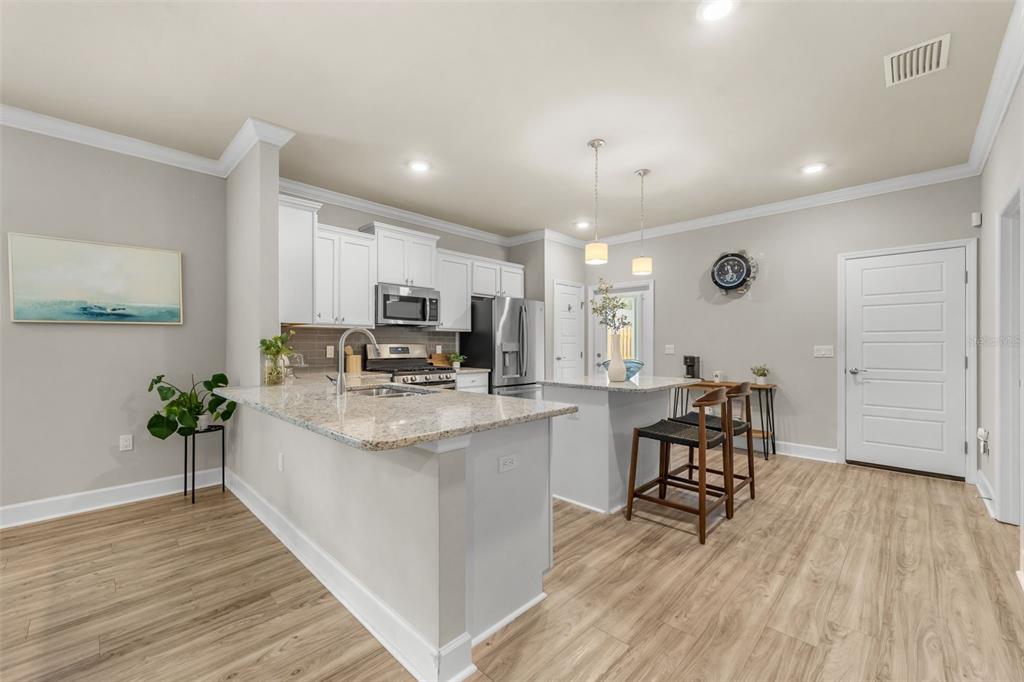 9437 Southwest 67th Lane Gainesville, FL 32608 - Photo 8 of 41 a kitchen with sink and cabinets