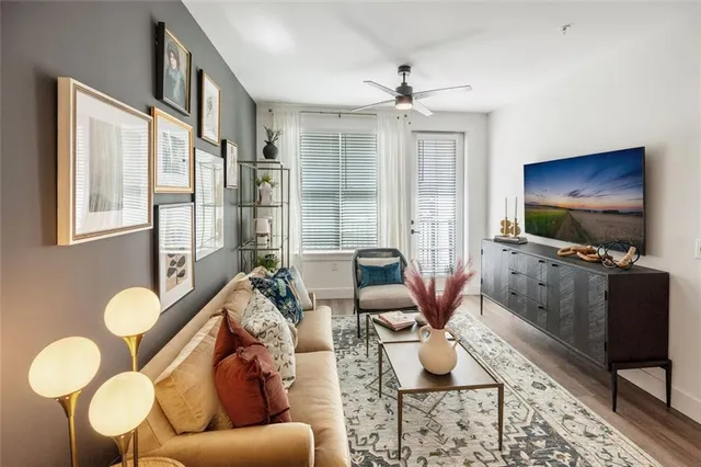 a living room with furniture and a flat screen tv