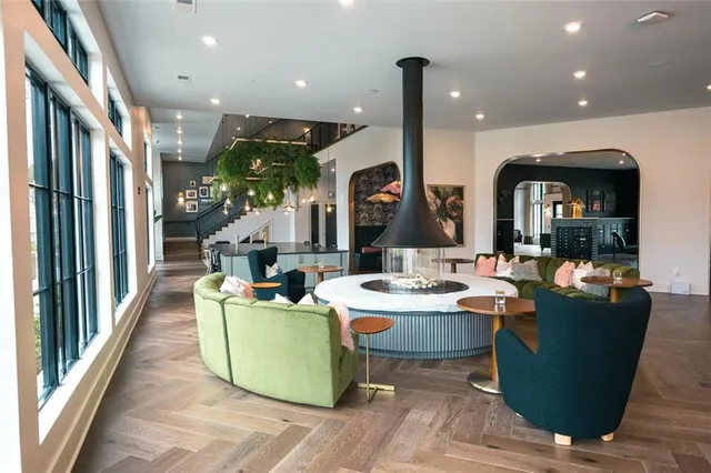 a dining room with furniture and wooden floor