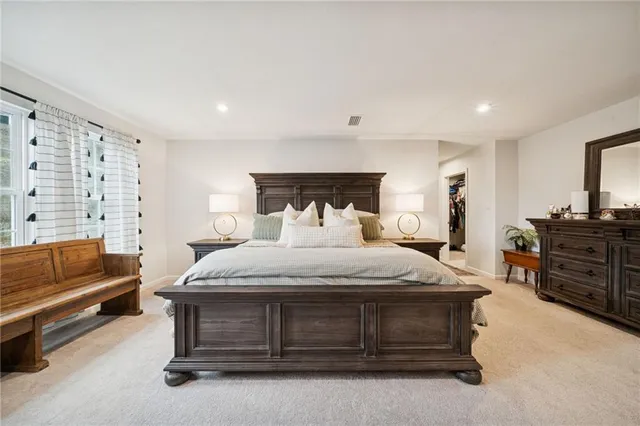 a bedroom with a bed and furniture