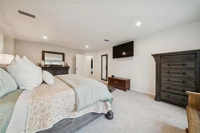 a bed room with a bed and a television