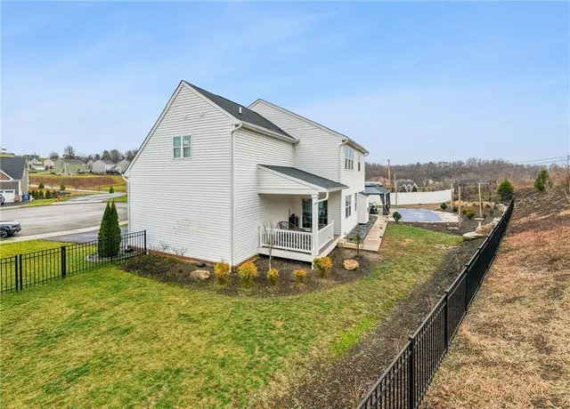 a view of a backyard with a sitting area