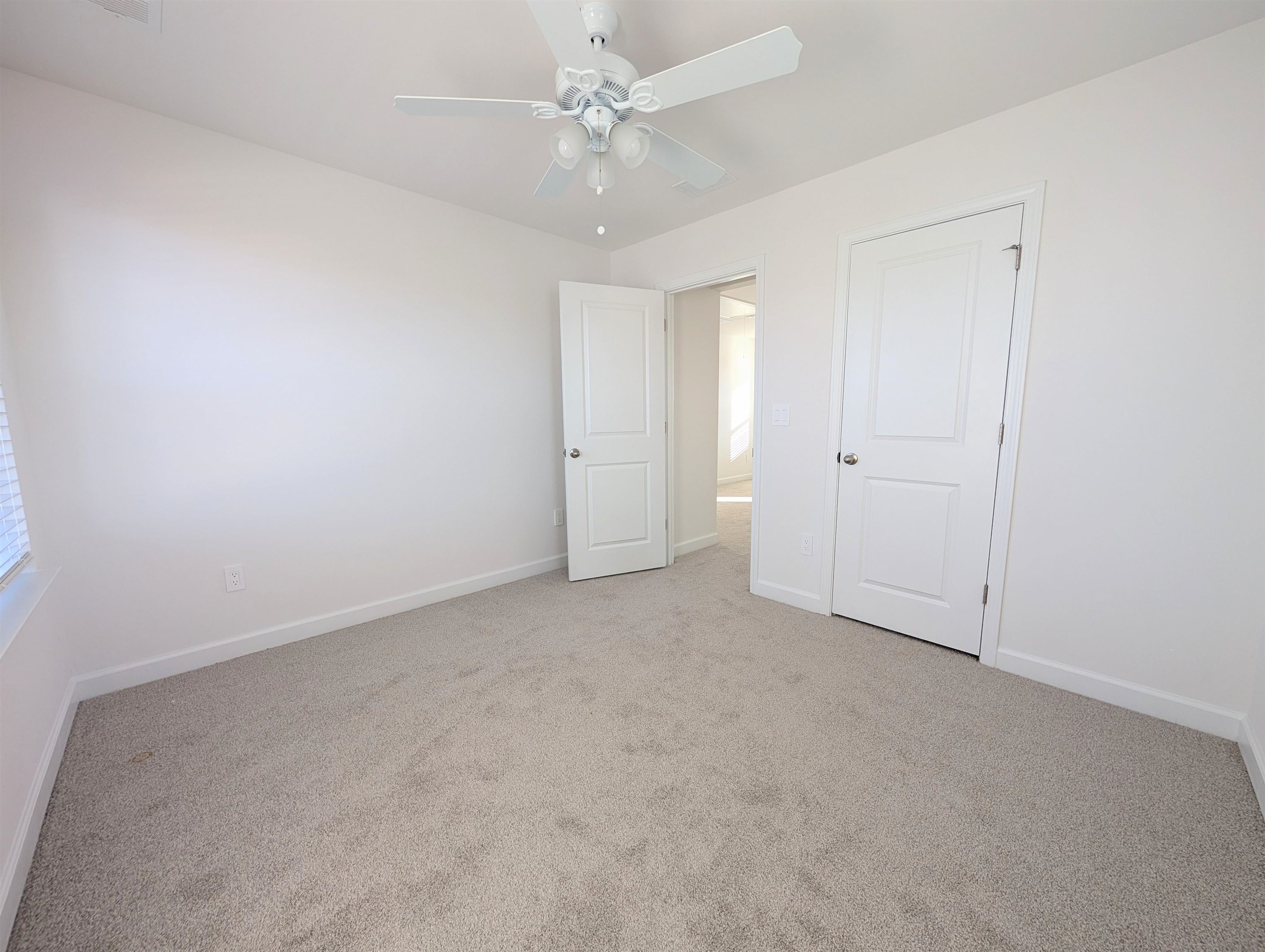 1508 Regal Fern Way Longs, SC 29568 - Photo 26 of 38 Unfurnished bedroom featuring light carpet and a ceiling fan