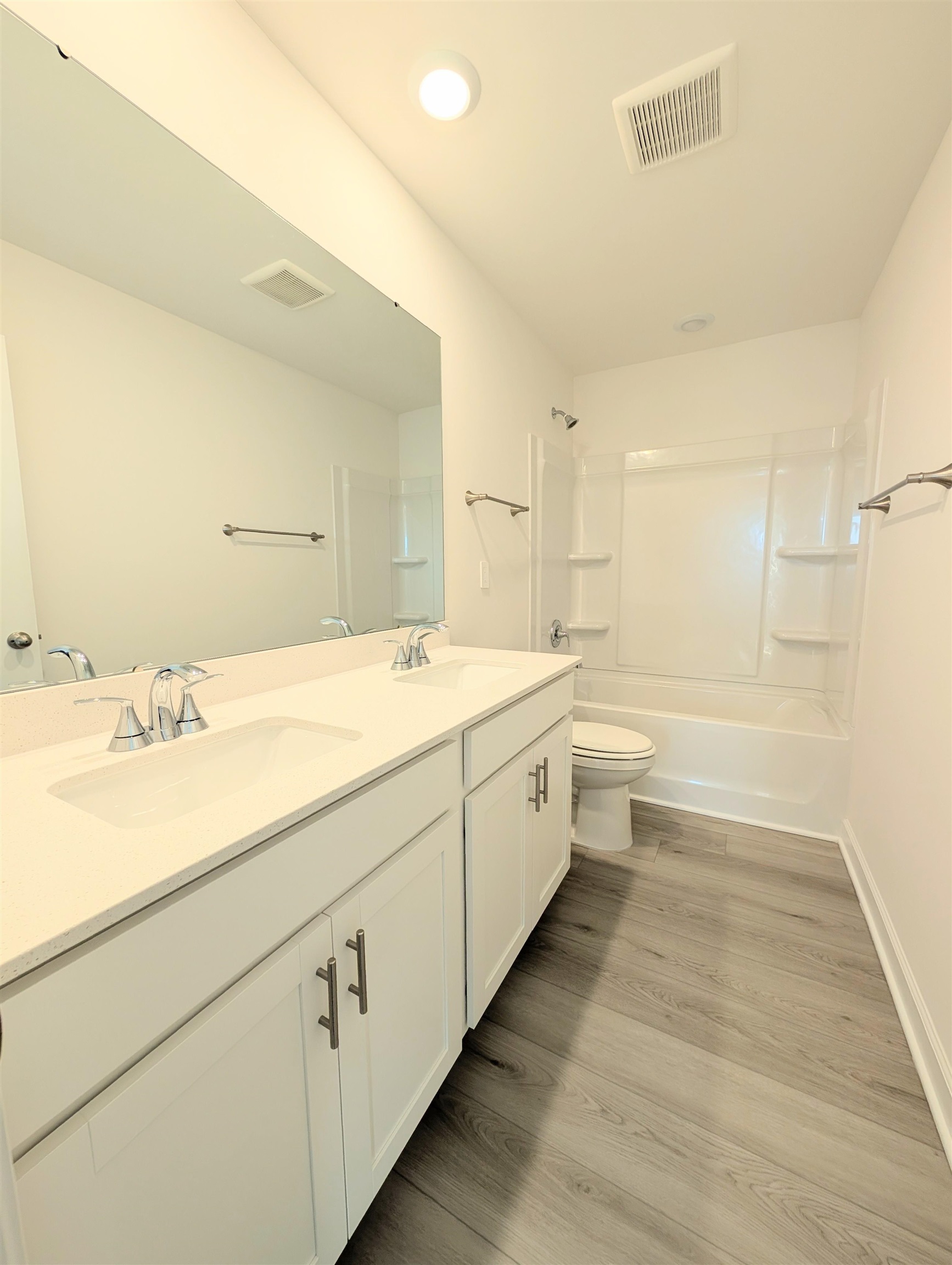 1508 Regal Fern Way Longs, SC 29568 - Photo 28 of 38 Bathroom featuring washtub / shower combination, double vanity, and light wood-style flooring