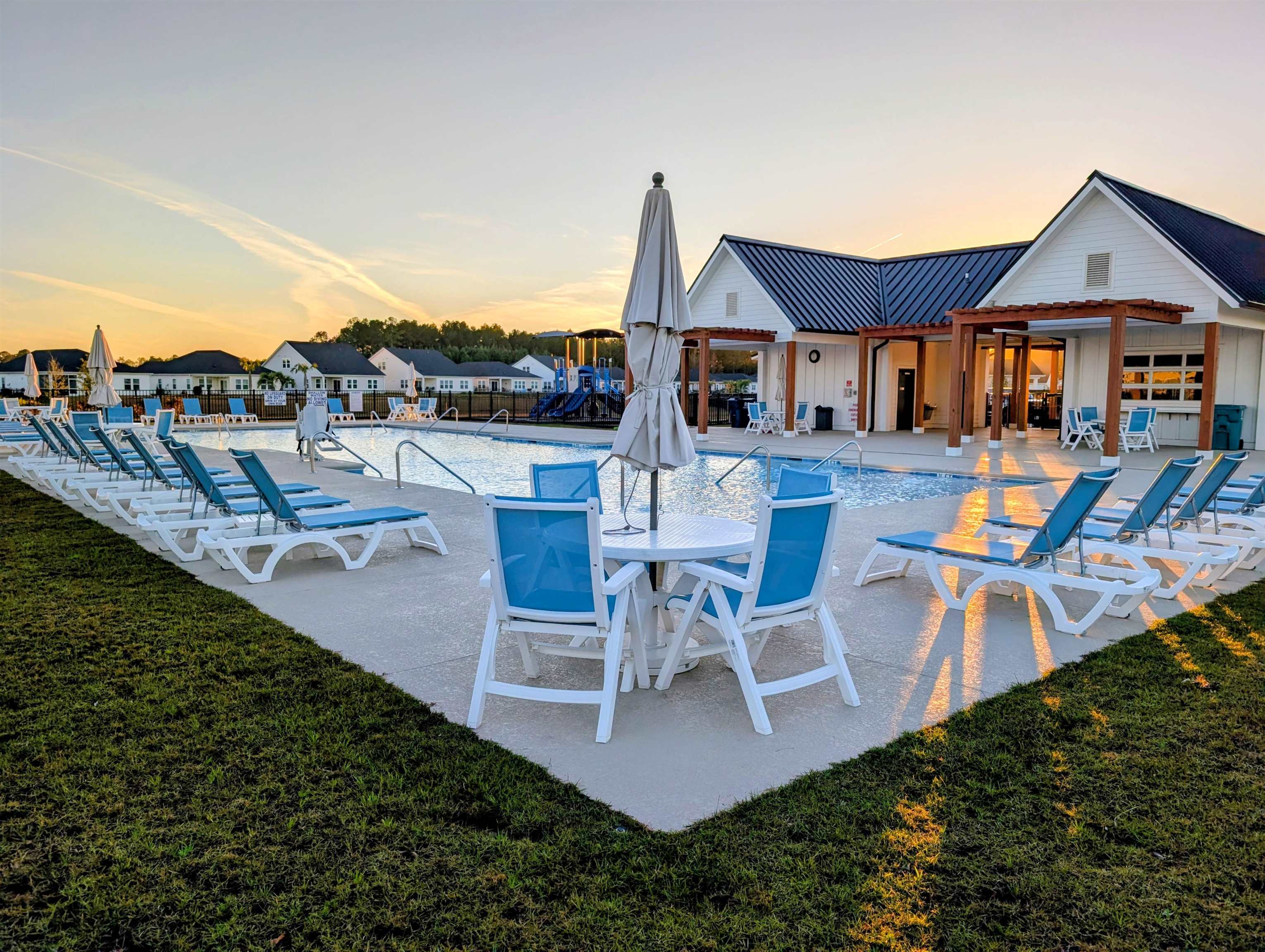1508 Regal Fern Way Longs, SC 29568 - Photo 38 of 38 Pool at dusk featuring a patio area