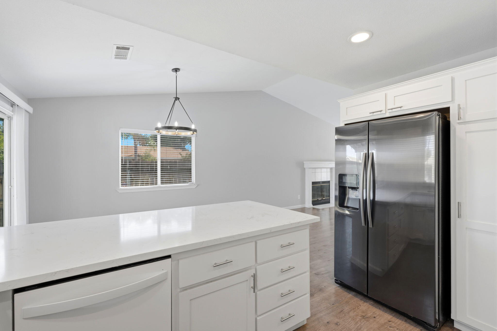 481 Katelyn Court Exeter, CA 93221 - Photo 28 of 33 a kitchen with a refrigerator and ceiling cabinets