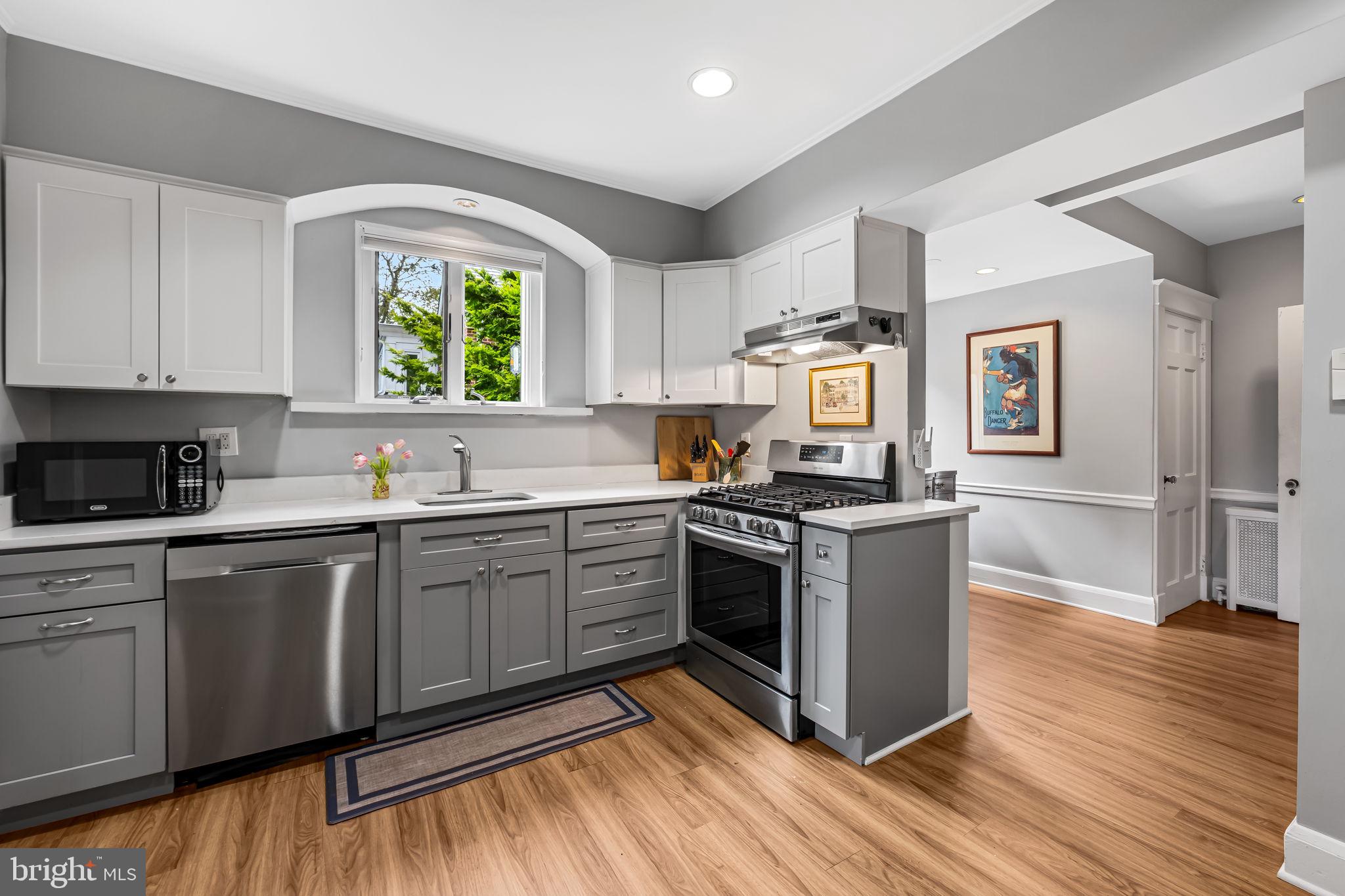 305 Tunbridge Road Baltimore, MD 21212 - Photo 16 of 58 a kitchen with stainless steel appliances granite countertop a stove and a sink