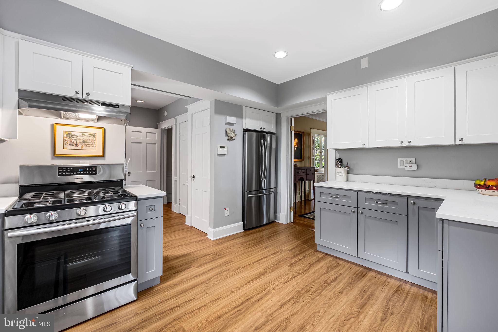 305 Tunbridge Road Baltimore, MD 21212 - Photo 17 of 58 a kitchen with wooden floors and appliances