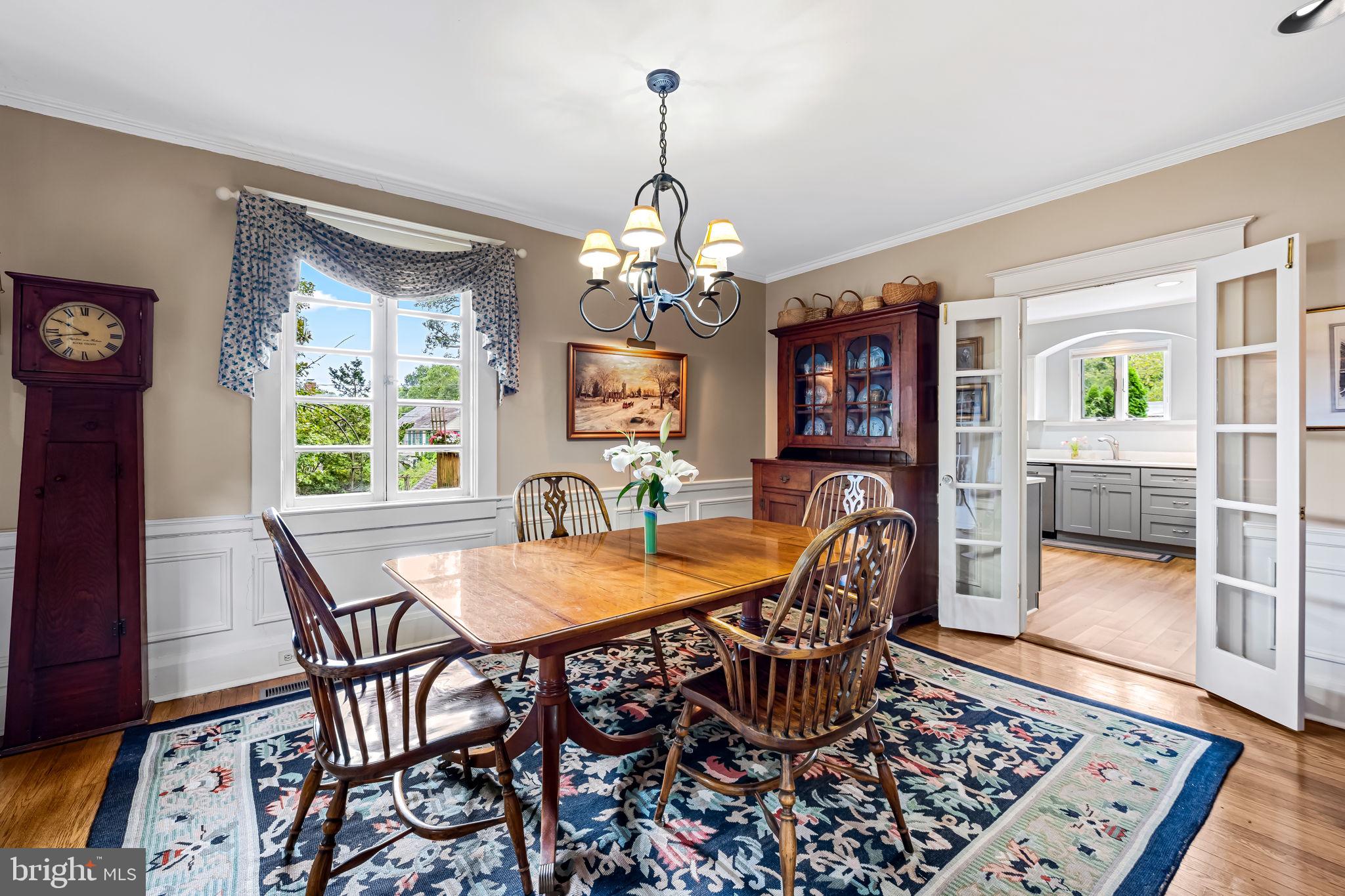 305 Tunbridge Road Baltimore, MD 21212 - Photo 20 of 58 a view of a dining room with furniture wooden floor and chandelier