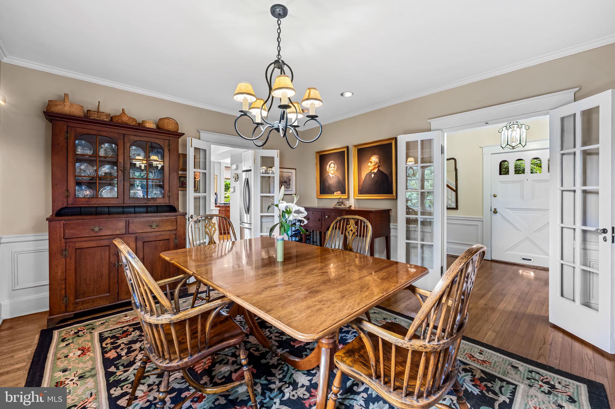 305 Tunbridge Road Baltimore, MD 21212 - Photo 21 of 58 a view of a dining room with furniture a chandelier and wooden floor
