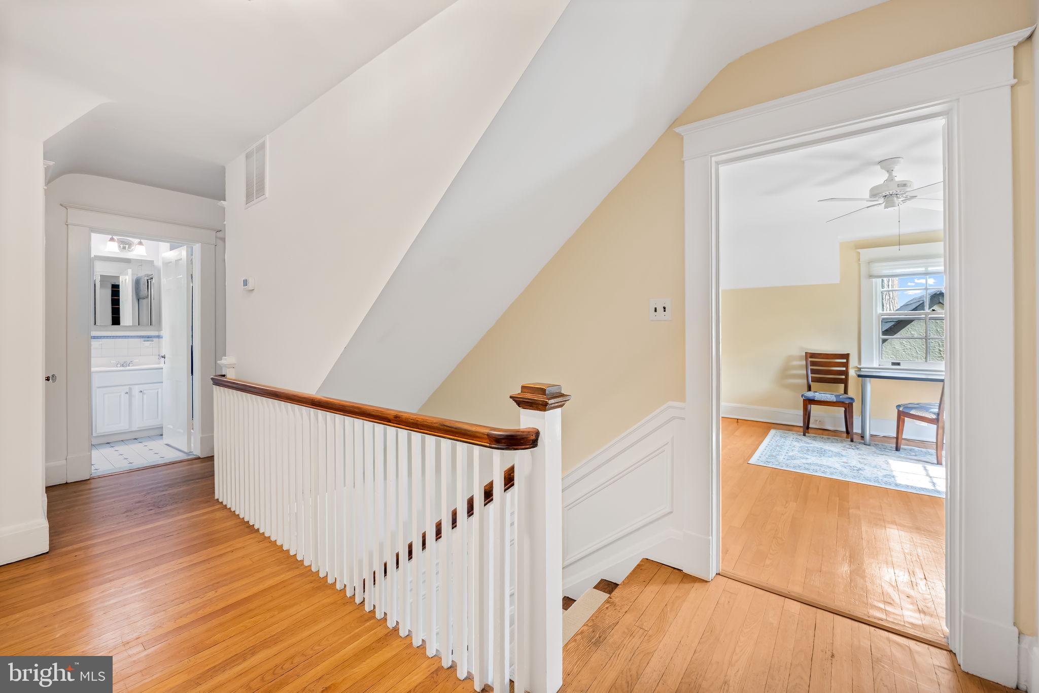 305 Tunbridge Road Baltimore, MD 21212 - Photo 29 of 58 a view of a hallway with wooden floor and furniture