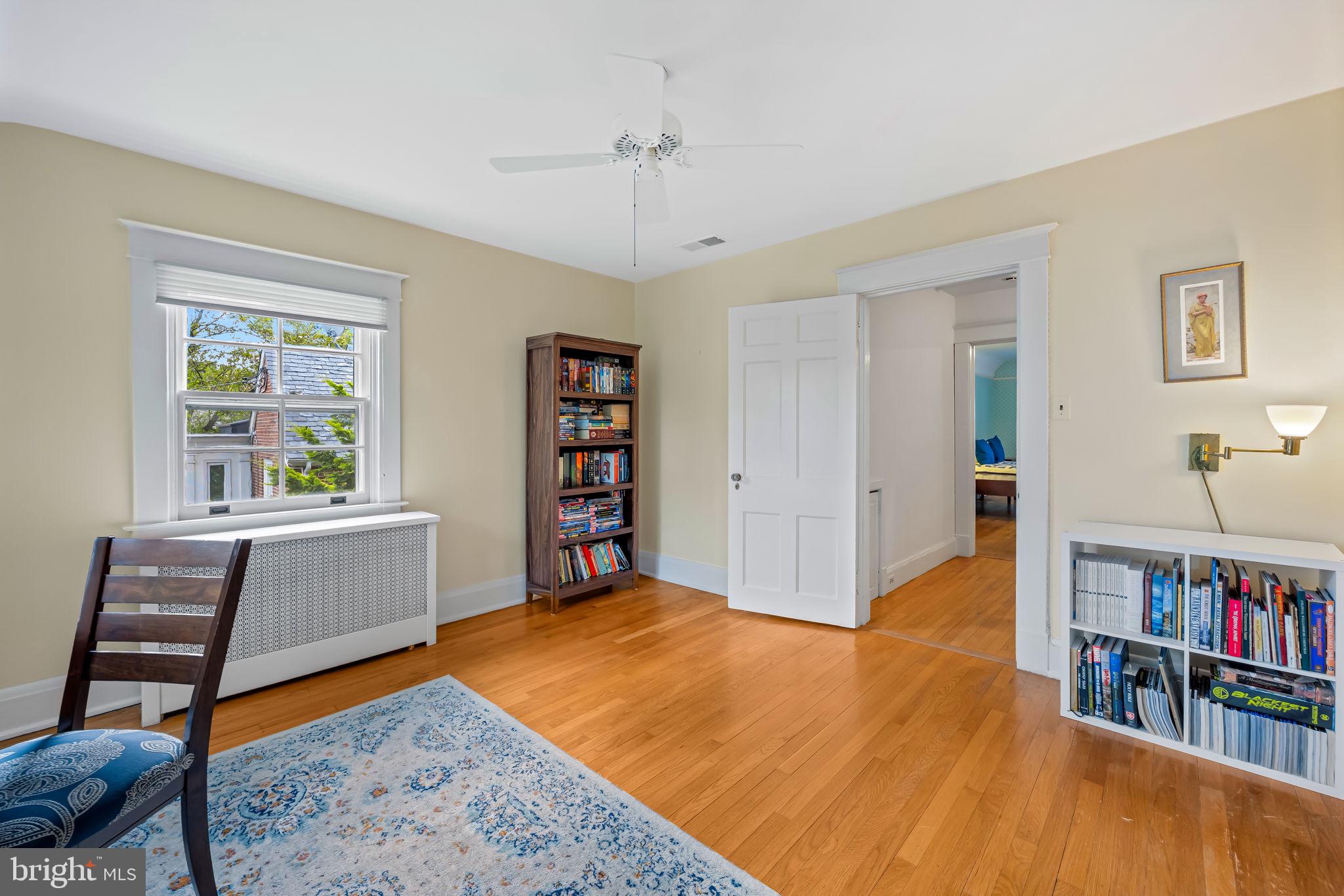 305 Tunbridge Road Baltimore, MD 21212 - Photo 31 of 58 a view of an empty room with furniture and book shelf