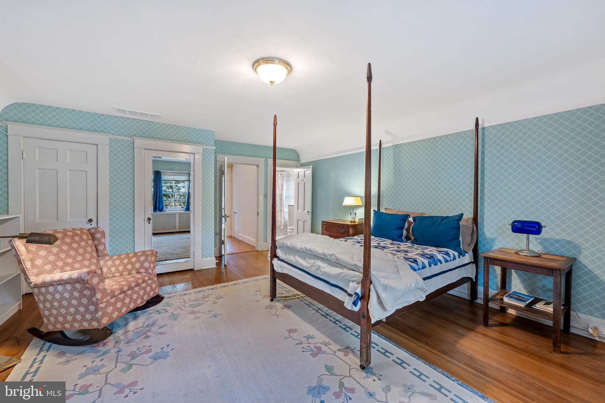 305 Tunbridge Road Baltimore, MD 21212 - Photo 34 of 58 a bedroom with furniture and a wooden floor