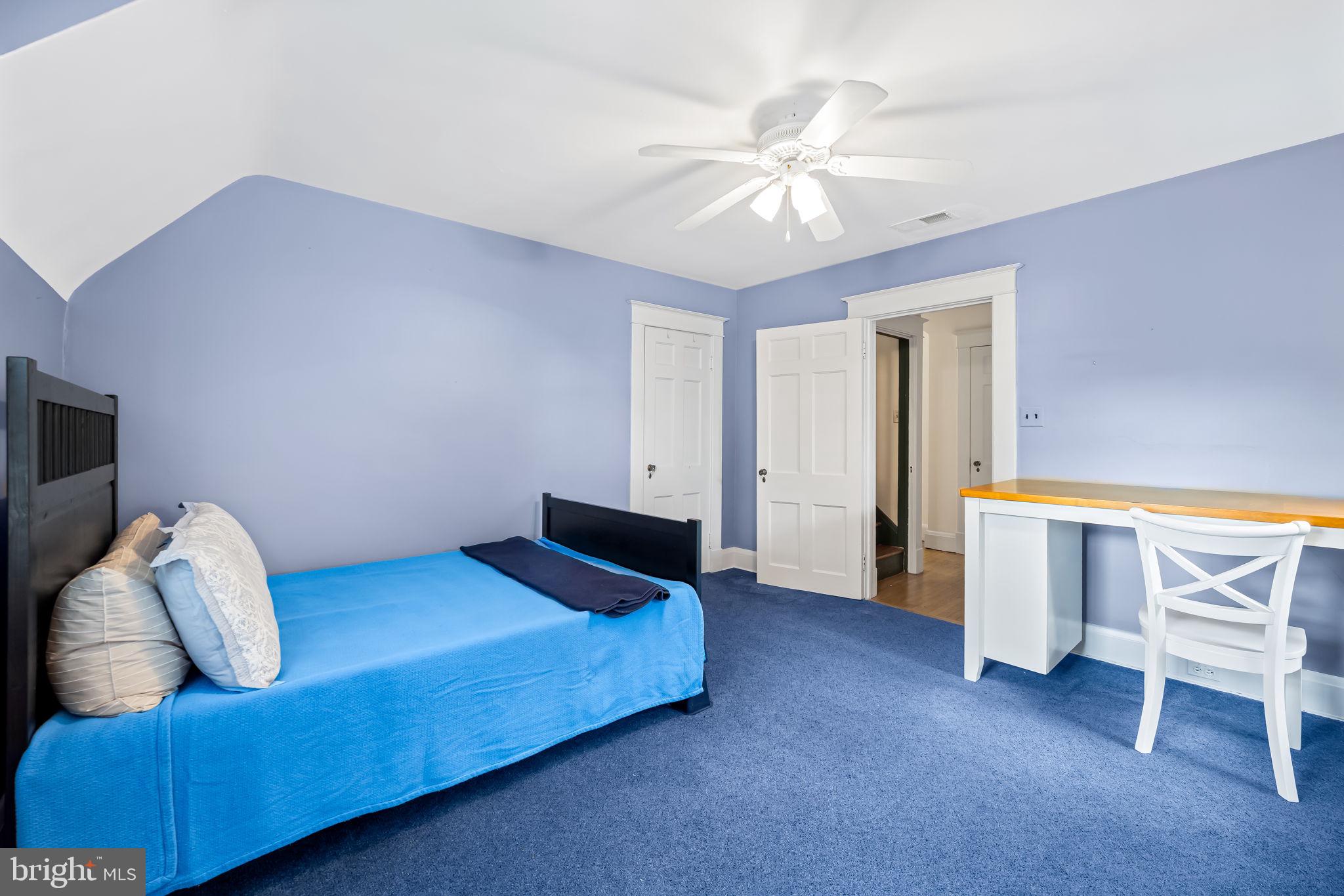 305 Tunbridge Road Baltimore, MD 21212 - Photo 40 of 58 a bedroom with a bed and a chandelier