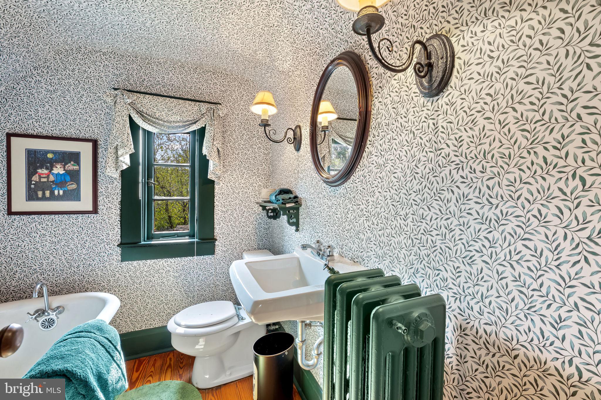 305 Tunbridge Road Baltimore, MD 21212 - Photo 44 of 58 a bathroom with a toilet and a sink