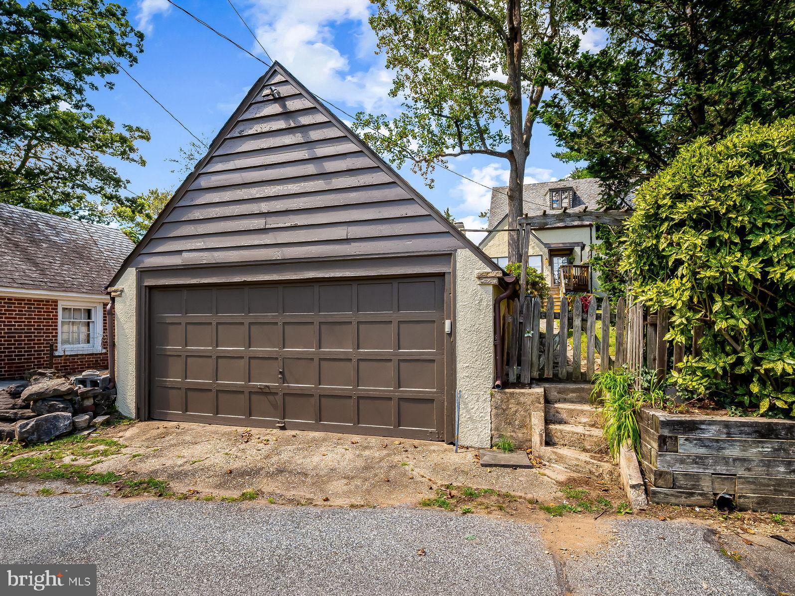 305 Tunbridge Road Baltimore, MD 21212 - Photo 57 of 58 a front view of a house with a yard and garage