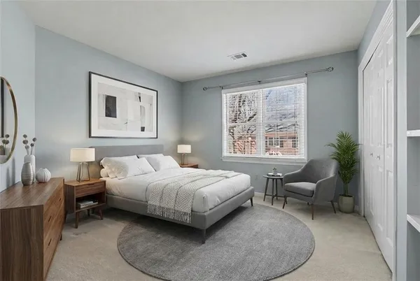 a bedroom with a bed and a window
