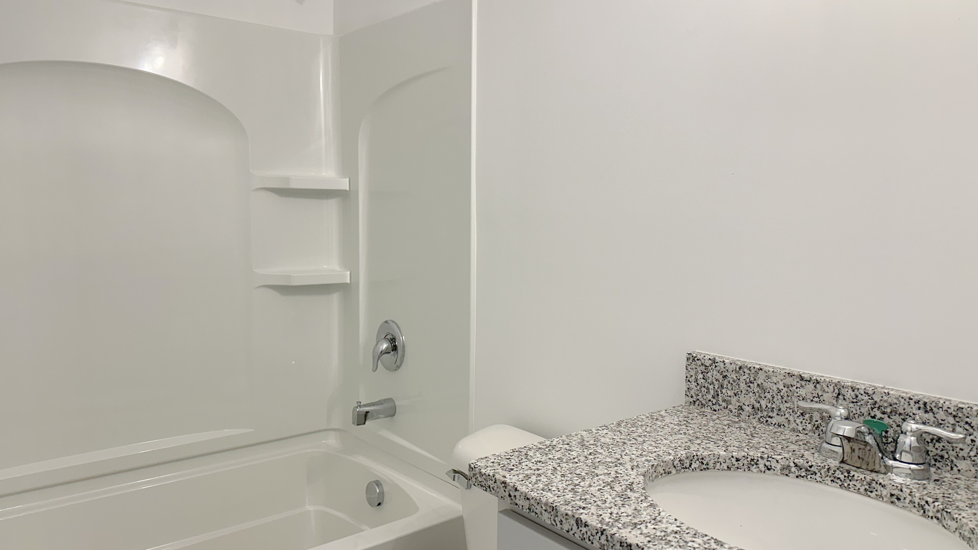 119 West Cache Isle Circle Channahon, IL 60410 - Photo 30 of 31 a bathroom with a granite countertop sink and a bathtub