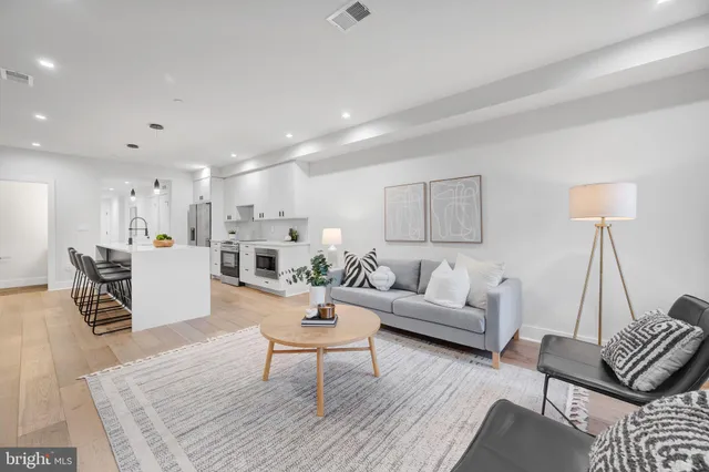 a living room with furniture and a table