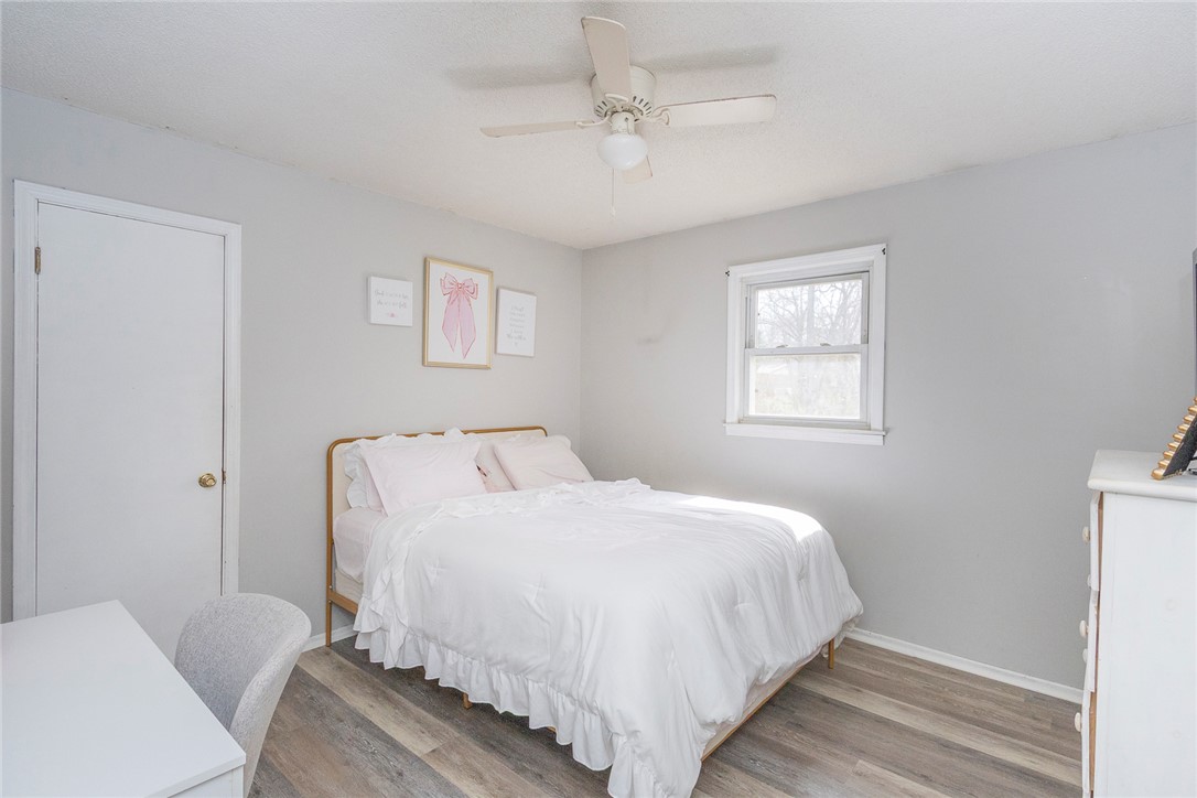 1331 Centerville Road Anderson, SC 29625 - Photo 14 of 35 This inviting bedroom features natural light, hard surface flooring, and a ceiling fan for comfort.