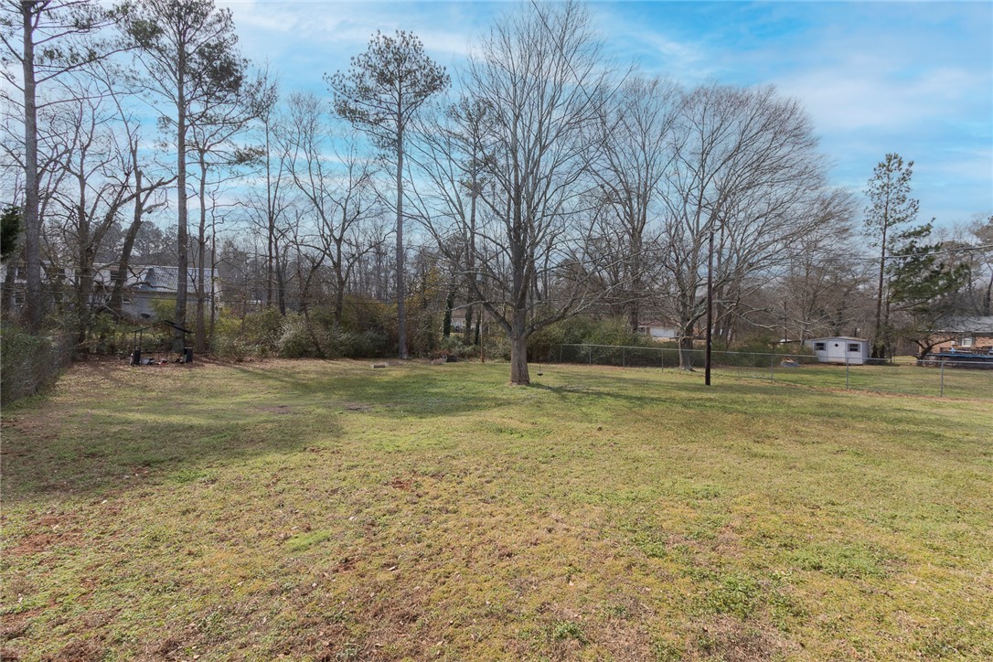 1331 Centerville Road Anderson, SC 29625 - Photo 29 of 35 Expansive green yard with mature trees offers a serene natural setting.
