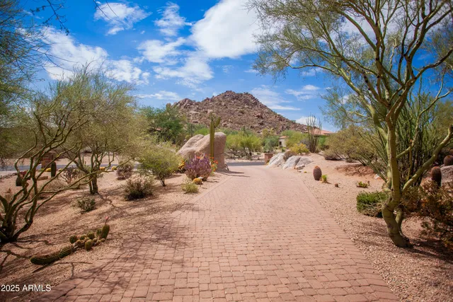 a bedroom with a bed and a mirror