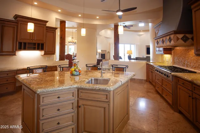 a view of a porch with chairs and backyard