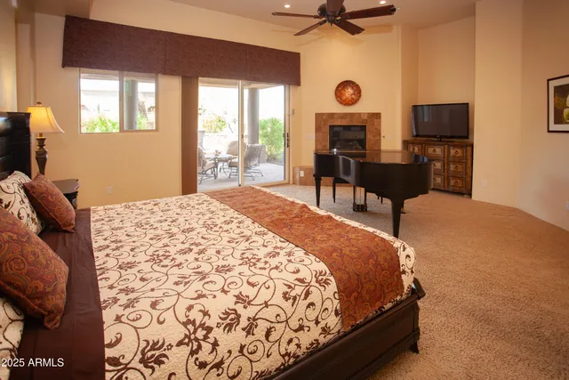 a view of a patio with table and chairs and potted plants