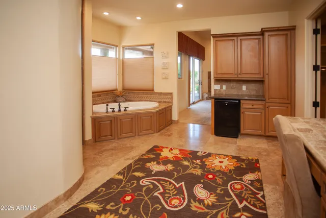 a view of a patio with table and chairs and potted plants