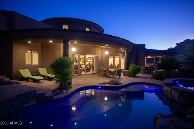 a view of backyard with outdoor seating and green space