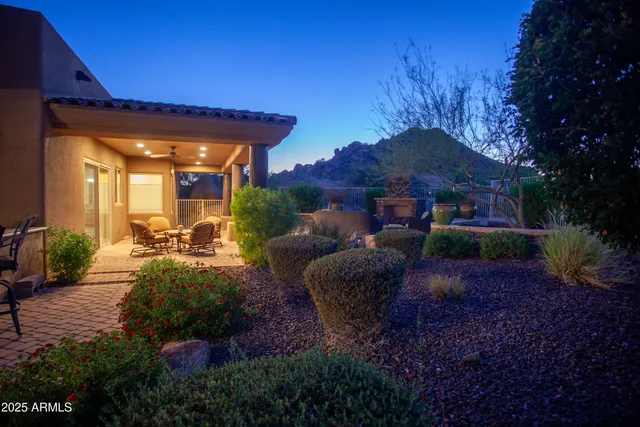a view of swimming pool outdoor seating and city view