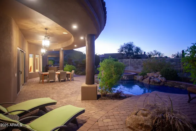 a view of a swimming pool with a lounge chairs