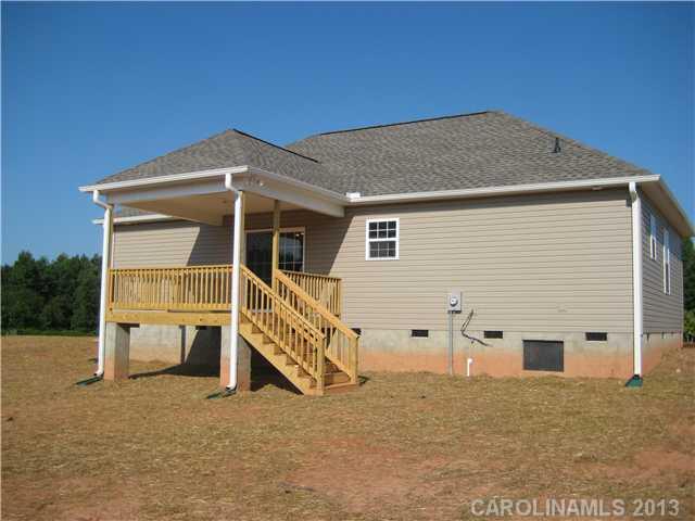 305 Springlake Road York, SC 29745 - Photo 16 of 16 a view of a house with backyard