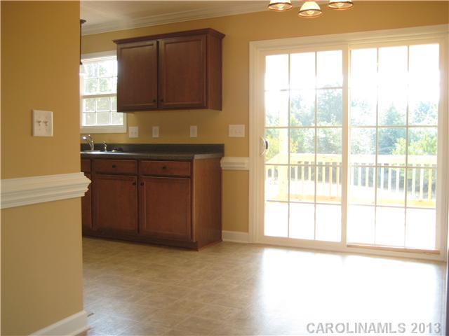 305 Springlake Road York, SC 29745 - Photo 8 of 16 a kitchen with a stove a sink and a microwave