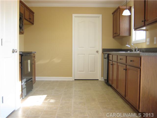 305 Springlake Road York, SC 29745 - Photo 10 of 16 a view of a kitchen from the hallway