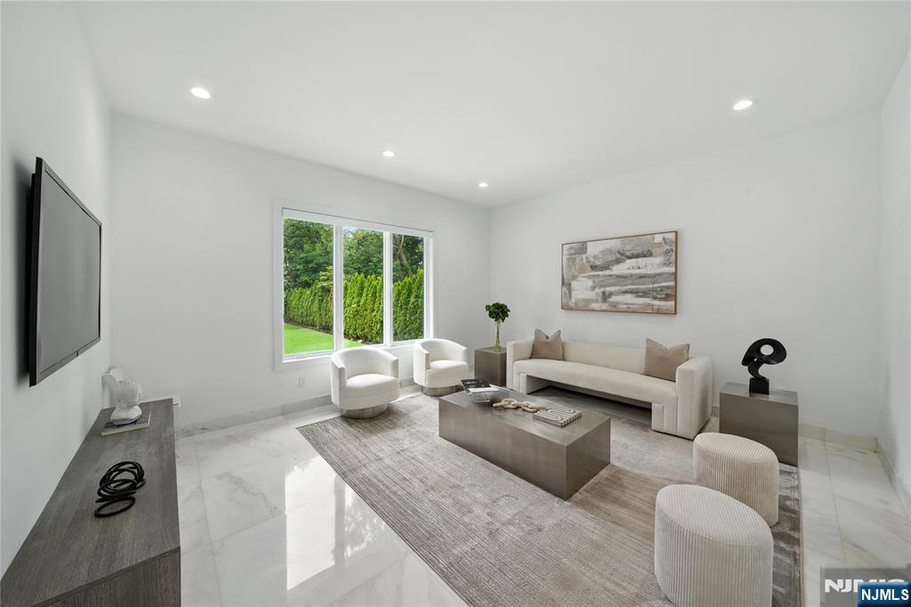 44 Floral Terrace Tenafly, NJ 07670 - Photo 13 of 49 a living room with furniture and a flat screen tv