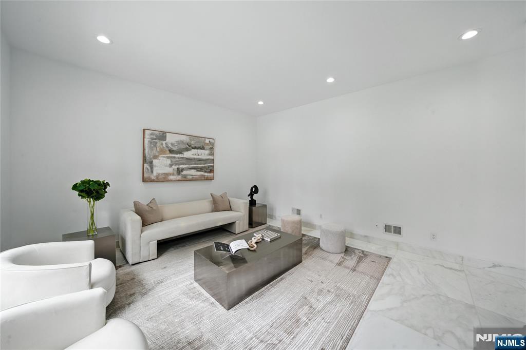 44 Floral Terrace Tenafly, NJ 07670 - Photo 15 of 49 a living room with furniture and painting on the wall